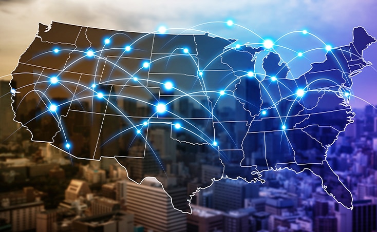 This animated image displays the United States map highlighted in blue, pinpointing all locations where Eggs Unlimited delivers and picks up from their warehouses. It also marks the states where market analysis has been conducted, set against a city background, showcasing the company's extensive reach and detailed market insight and analysis.