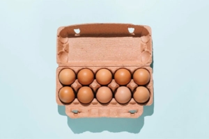 This photo showcases a selection of brown eggs, accompanying an article on Eggs Unlimited's news page discussing the factors contributing to the current high cost of eggs.